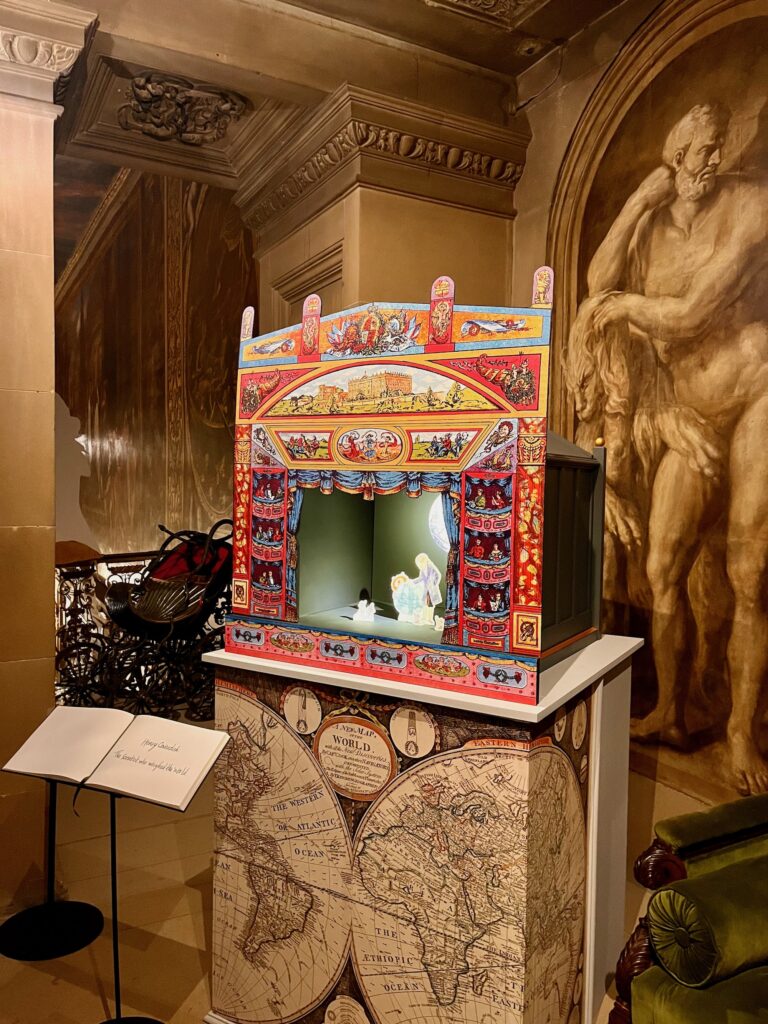 Small Theatre with Story by Joseph Cohello illustrated by Vivien Mildenberger at Chatsworth House, Christmas 2024. Theatre Proscenium by Pollocks Studio
